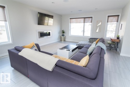 9104 83 Street, Edmonton, AB - Indoor Photo Showing Living Room With Fireplace
