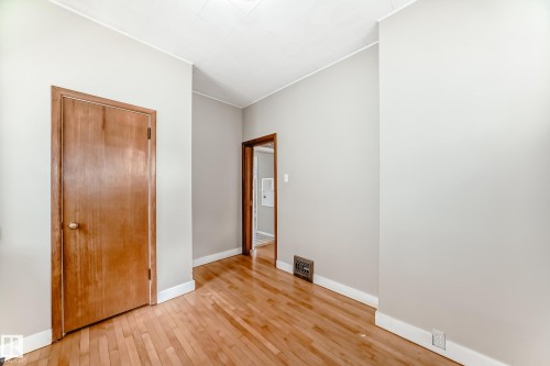 Unfurnished bedroom featuring light wood-style floors and a closet - 12605 107 Avenue, Edmonton, AB - Indoor Photo Showing Other Room