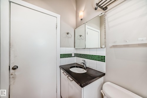 Bathroom featuring backsplash and vanity - 12605 107 Avenue, Edmonton, AB - Indoor Photo Showing Bathroom
