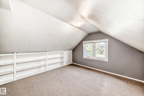 bed room featuring lofted ceiling and carpet floors - 12605 107 Avenue, Edmonton, AB - Indoor Photo Showing Other Room