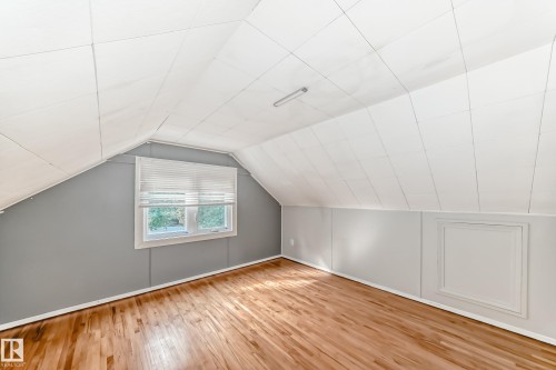 bedroom living space with wood finished floors and lofted ceiling - 12605 107 Avenue, Edmonton, AB - Indoor Photo Showing Other Room