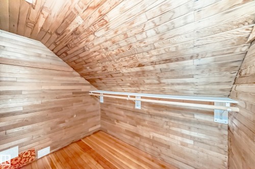 Spacious closet with vaulted ceiling and hardwood / wood-style flooring - 12605 107 Avenue, Edmonton, AB - Indoor Photo Showing Other Room