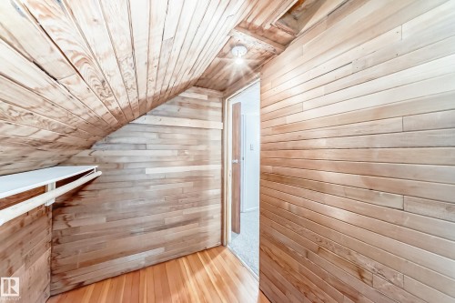 Bonus room featuring wooden walls, wood ceiling, hardwood / wood-style flooring, and lofted ceiling - 12605 107 Avenue, Edmonton, AB - Indoor Photo Showing Other Room