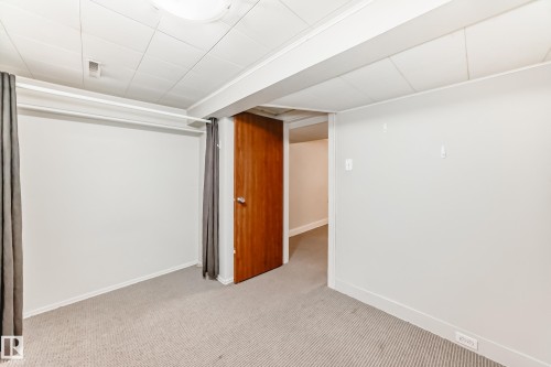 Below grade bedroom with carpet and a paneled ceiling - 12605 107 Avenue, Edmonton, AB - Indoor Photo Showing Other Room