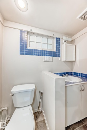 Bathroom featuring toilet and tile patterned floors - 12605 107 Avenue, Edmonton, AB - Indoor Photo Showing Bathroom