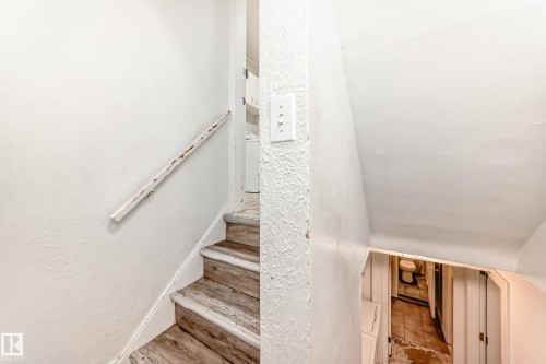 Stairs featuring a textured wall - 12605 107 Avenue, Edmonton, AB - Indoor Photo Showing Other Room