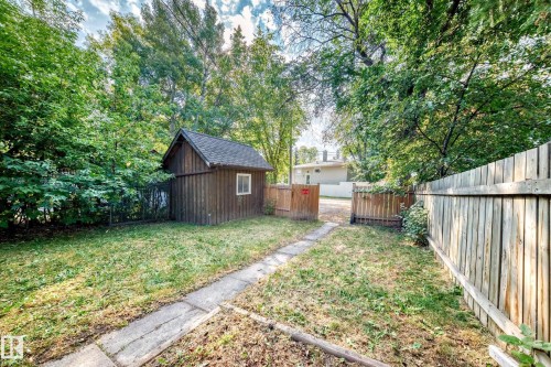 Fenced backyard featuring a storage unit - 12605 107 Avenue, Edmonton, AB - Outdoor