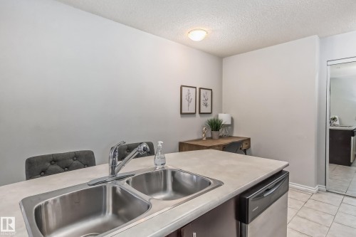 115 10118 106 Avenue, Edmonton, AB - Indoor Photo Showing Kitchen With Double Sink