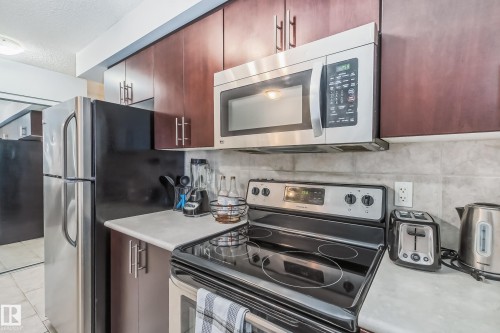 115 10118 106 Avenue, Edmonton, AB - Indoor Photo Showing Kitchen With Stainless Steel Kitchen