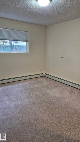 114 2430 Guardian Road, Edmonton, AB - Indoor Photo Showing Other Room