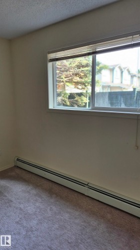 114 2430 Guardian Road, Edmonton, AB - Indoor Photo Showing Other Room