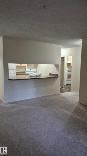 114 2430 Guardian Road, Edmonton, AB - Indoor Photo Showing Other Room