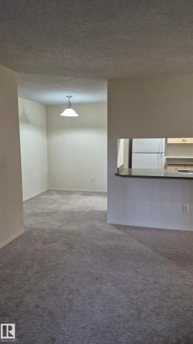 114 2430 Guardian Road, Edmonton, AB - Indoor Photo Showing Other Room