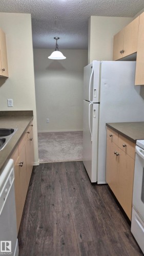 114 2430 Guardian Road, Edmonton, AB - Indoor Photo Showing Kitchen