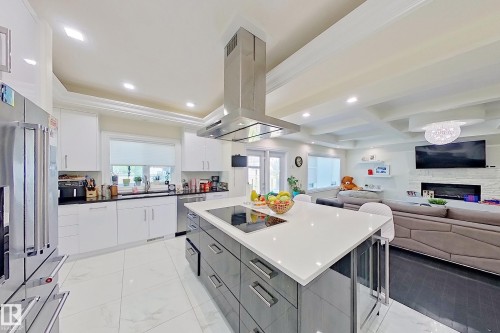 16611 9 St, Edmonton, AB - Indoor Photo Showing Kitchen With Fireplace