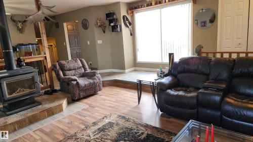 5101 58 Avenue, Elk Point, AB - Indoor Photo Showing Living Room With Fireplace