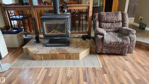 5101 58 Avenue, Elk Point, AB - Indoor Photo Showing Living Room With Fireplace