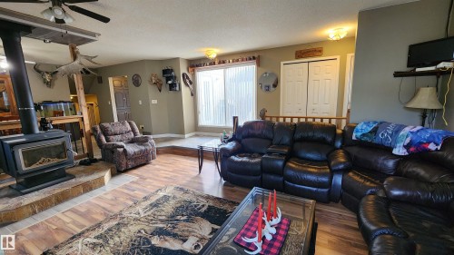5101 58 Avenue, Elk Point, AB - Indoor Photo Showing Living Room With Fireplace
