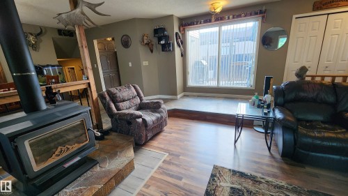 5101 58 Avenue, Elk Point, AB - Indoor Photo Showing Living Room With Fireplace