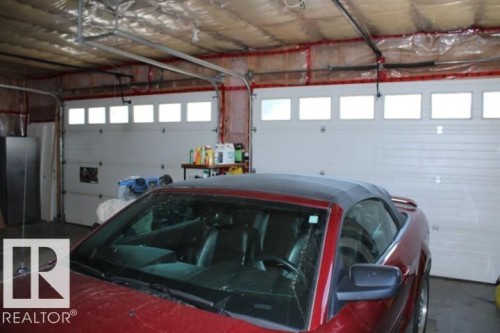 28 Silver Beach, Rural Wetaskiwin County, AB - Indoor Photo Showing Garage