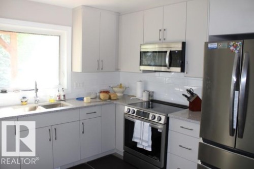 28 Silver Beach, Rural Wetaskiwin County, AB - Indoor Photo Showing Kitchen With Double Sink With Upgraded Kitchen