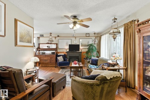 9608 98A Street, Morinville, AB - Indoor Photo Showing Living Room With Fireplace