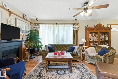 9608 98A Street, Morinville, AB - Indoor Photo Showing Living Room With Fireplace