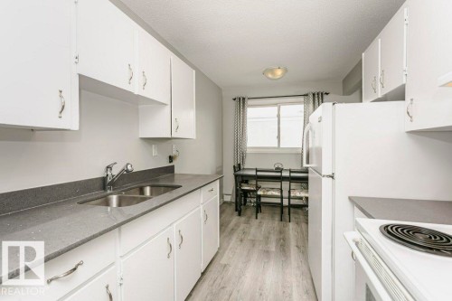 404 10320 113 Street, Edmonton, AB - Indoor Photo Showing Kitchen With Double Sink