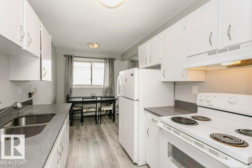 404 10320 113 Street, Edmonton, AB - Indoor Photo Showing Kitchen With Double Sink