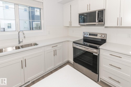 14 735 Allard Boulevard Sw, Edmonton, AB - Indoor Photo Showing Kitchen With Double Sink With Upgraded Kitchen