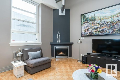 203 10009 102 Avenue, Edmonton, AB - Indoor Photo Showing Living Room With Fireplace