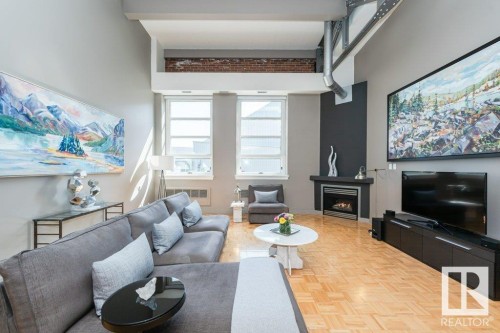 203 10009 102 Avenue, Edmonton, AB - Indoor Photo Showing Living Room With Fireplace