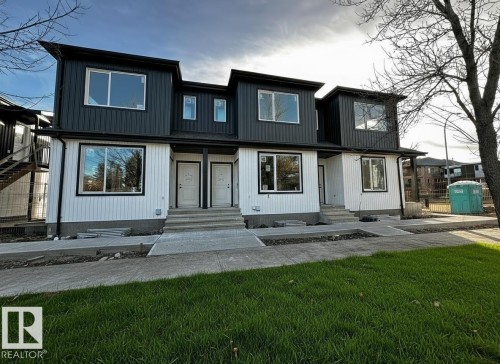 View of front facade featuring a front yard. Real photo from 14807 99 Ave project. same layout. - 14807 98 Avenue Nw, Edmonton, AB - Outdoor