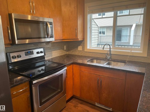 15 7289 South Terwillegar Drive, Edmonton, AB - Indoor Photo Showing Kitchen With Double Sink
