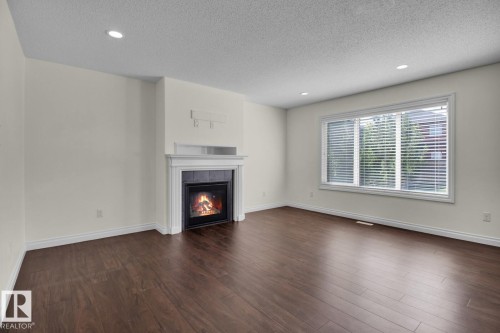 16540 131 Street, Edmonton, AB - Indoor Photo Showing Living Room With Fireplace