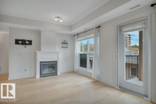 306 10232 115 Street, Edmonton, AB - Indoor Photo Showing Living Room With Fireplace