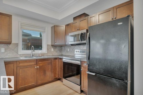 306 10232 115 Street, Edmonton, AB - Indoor Photo Showing Kitchen With Double Sink