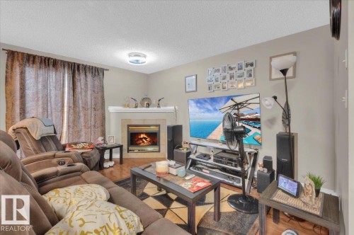1 345 Kirkness Road, Edmonton, AB - Indoor Photo Showing Living Room With Fireplace