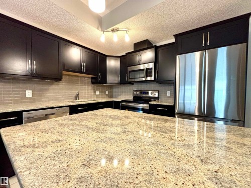 114 10510 56 Avenue, Edmonton, AB - Indoor Photo Showing Kitchen With Stainless Steel Kitchen With Double Sink With Upgraded Kitchen