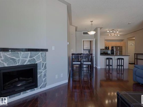 202 10707 102 Avenue, Edmonton, AB - Indoor Photo Showing Living Room With Fireplace
