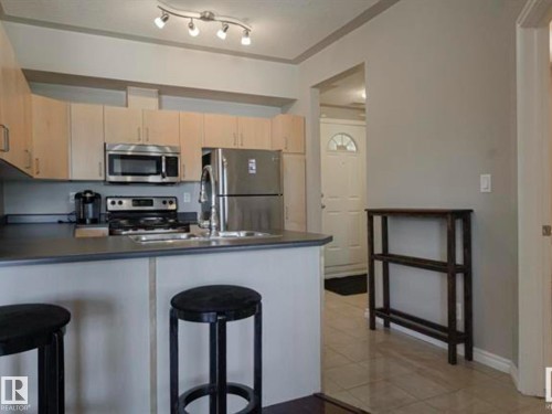 202 10707 102 Avenue, Edmonton, AB - Indoor Photo Showing Kitchen With Double Sink