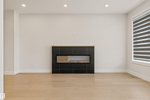 2 8343 Saskatchewan Drive, Edmonton, AB - Indoor Photo Showing Other Room With Fireplace