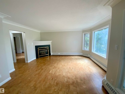 34 9914 80 Avenue, Edmonton, AB - Indoor Photo Showing Living Room With Fireplace