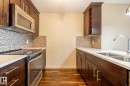 116 4008 Savaryn Drive, Edmonton, AB  - Indoor Photo Showing Kitchen With Double Sink With Upgraded Kitchen 