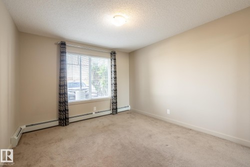 116 4008 Savaryn Drive, Edmonton, AB - Indoor Photo Showing Other Room