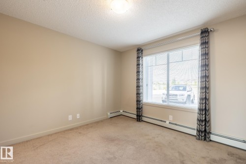 116 4008 Savaryn Drive, Edmonton, AB - Indoor Photo Showing Other Room
