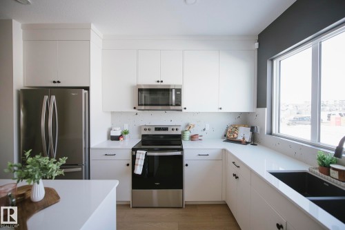 9079 Elves Loop, Edmonton, AB - Indoor Photo Showing Kitchen With Double Sink