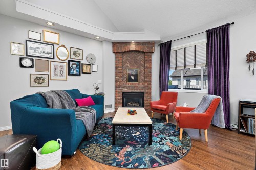 24 4821 Terwillegar Common, Edmonton, AB - Indoor Photo Showing Living Room With Fireplace