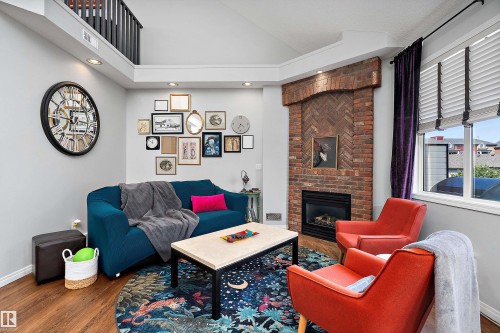 24 4821 Terwillegar Common, Edmonton, AB - Indoor Photo Showing Living Room With Fireplace