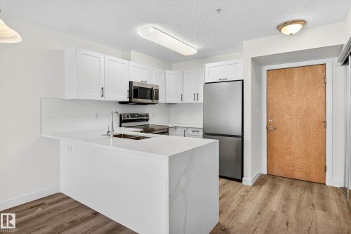 121 17404 64 Avenue, Edmonton, AB - Indoor Photo Showing Kitchen With Stainless Steel Kitchen With Double Sink
